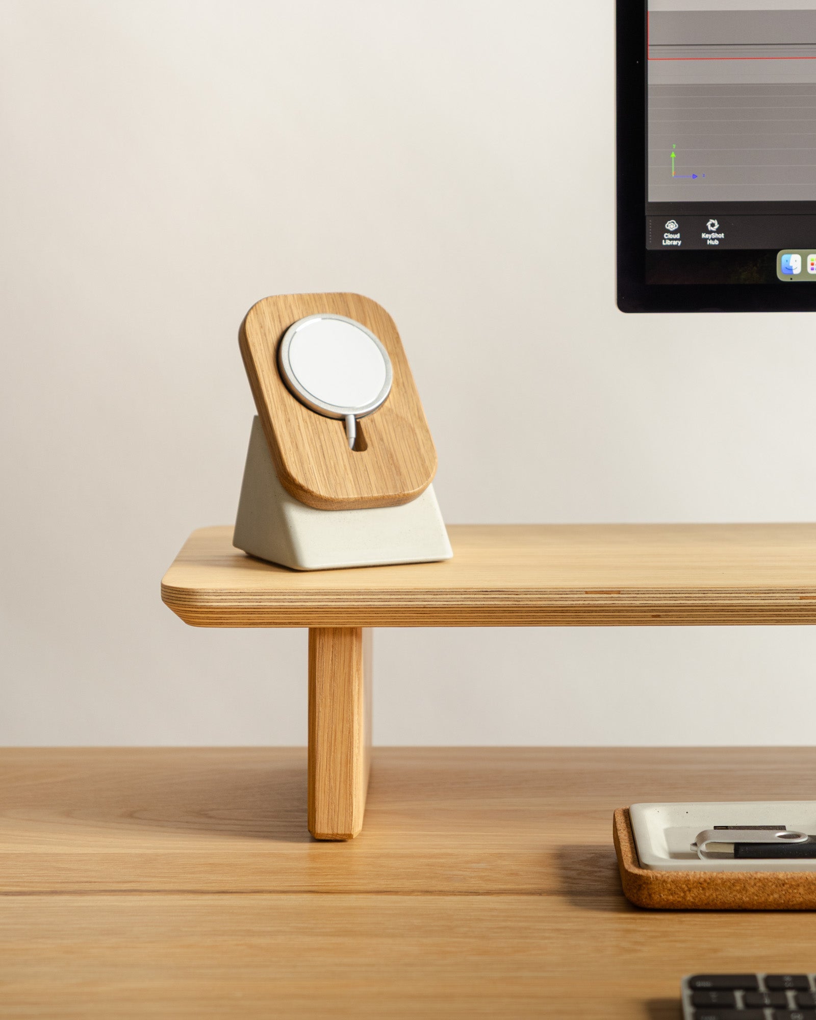Wooden desk organizer with a small mirror on a wooden surface.