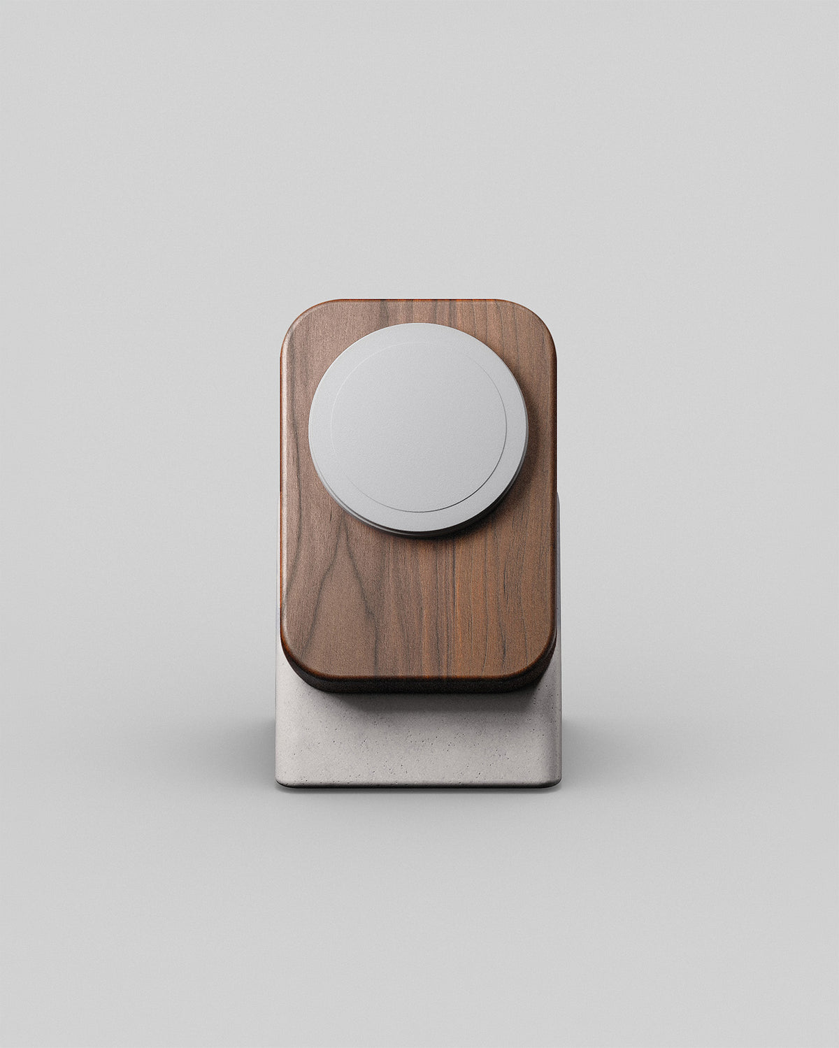 Upright wireless charging stand by Modhaus in walnut and stone concrete, front hero view on a light background