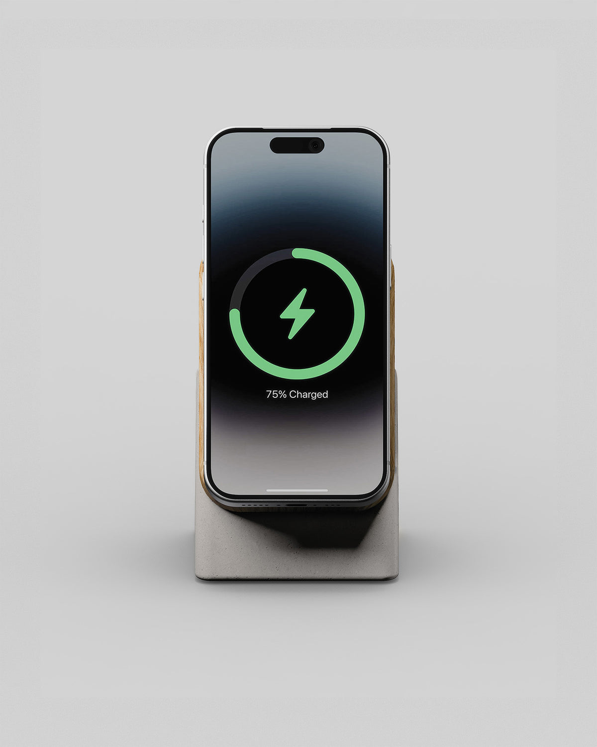 Upright wireless charging stand in oak and stone concrete, front view with a smartphone charging