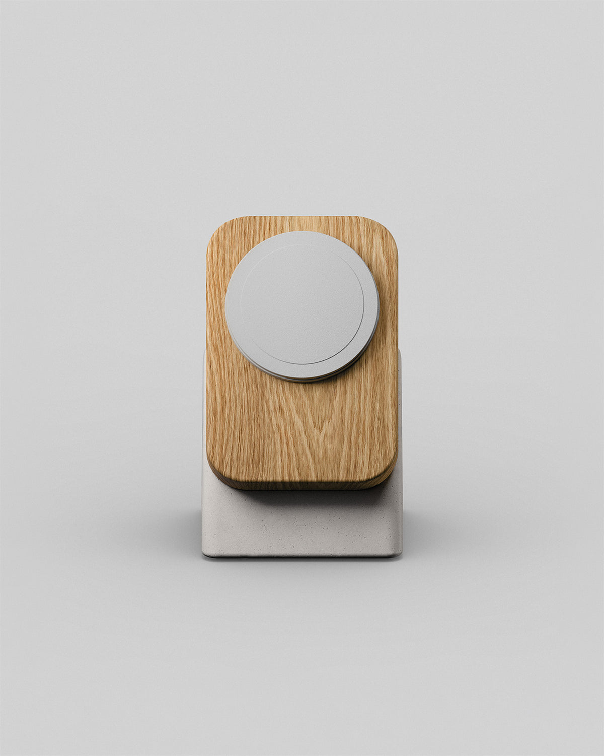 Upright wireless charging stand by Modhaus in oak and stone concrete, front hero view on a light background