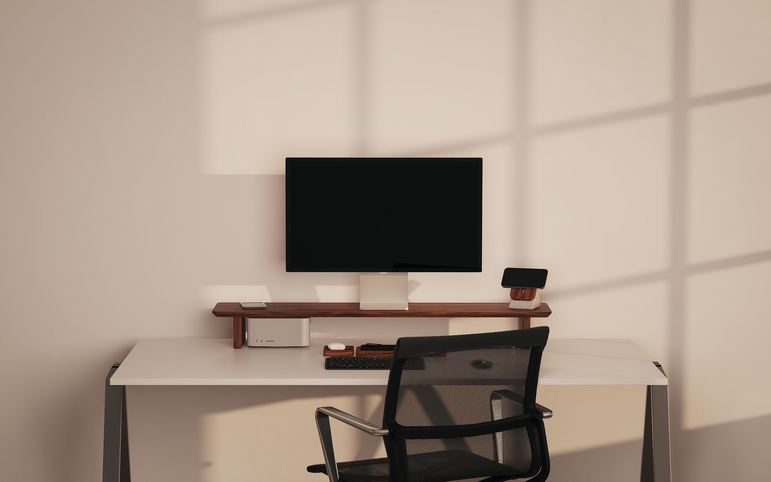 The Modhaus Desk Setup & Organization System in Walnut wood on a white desk