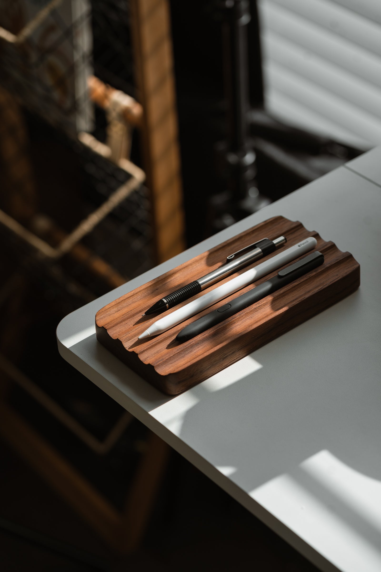 The Modhaus Wave Pen Tray in Walnut - a great desk accessory to help keep your home office workspace more organized.