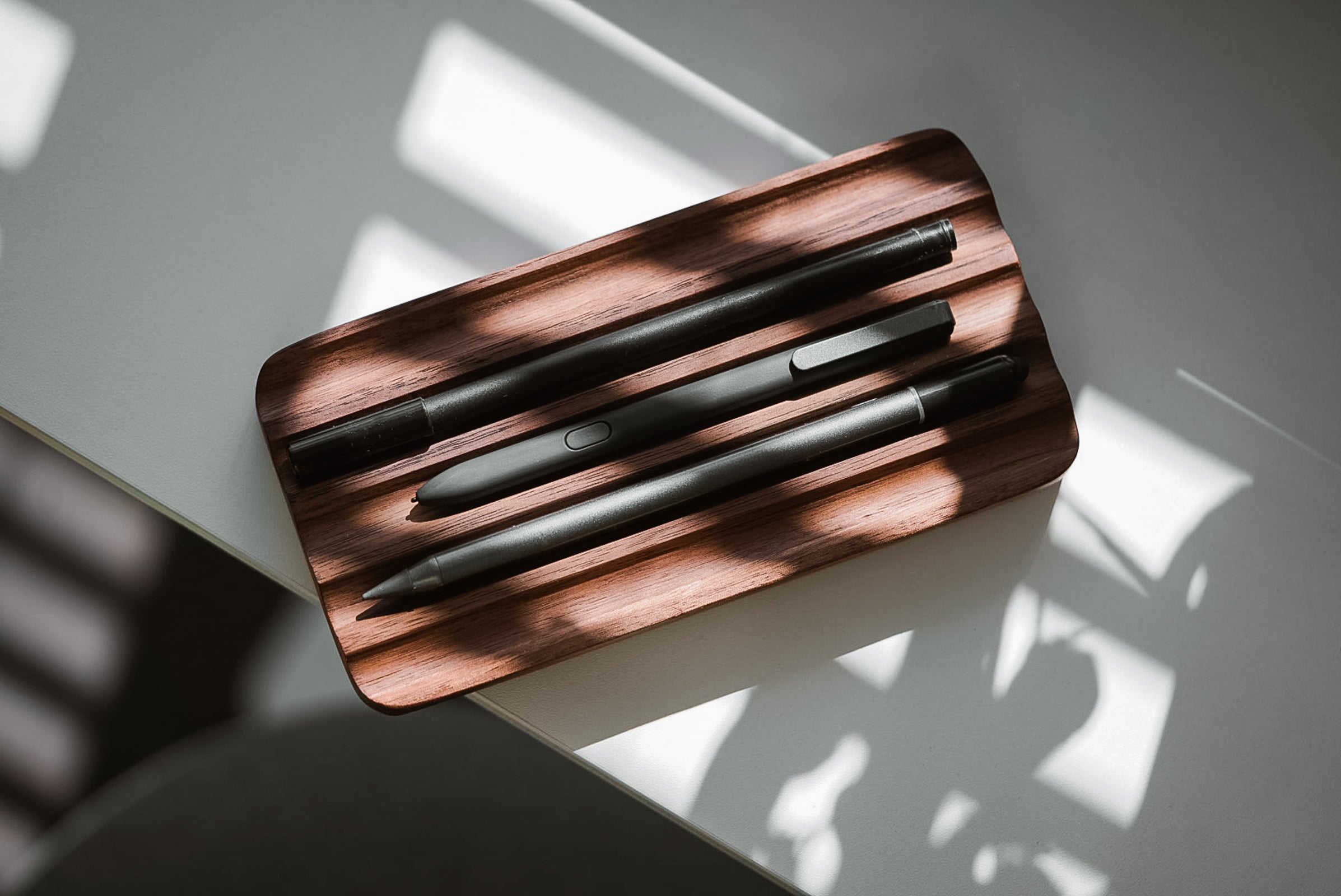 the Wave Pen Tray in Walnut. Perfect home for your favorite fountain pens.