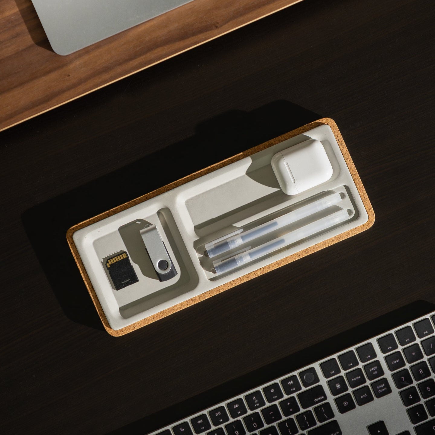 Organized desk setup with stationery items on a concrete desk tray by Modhaus