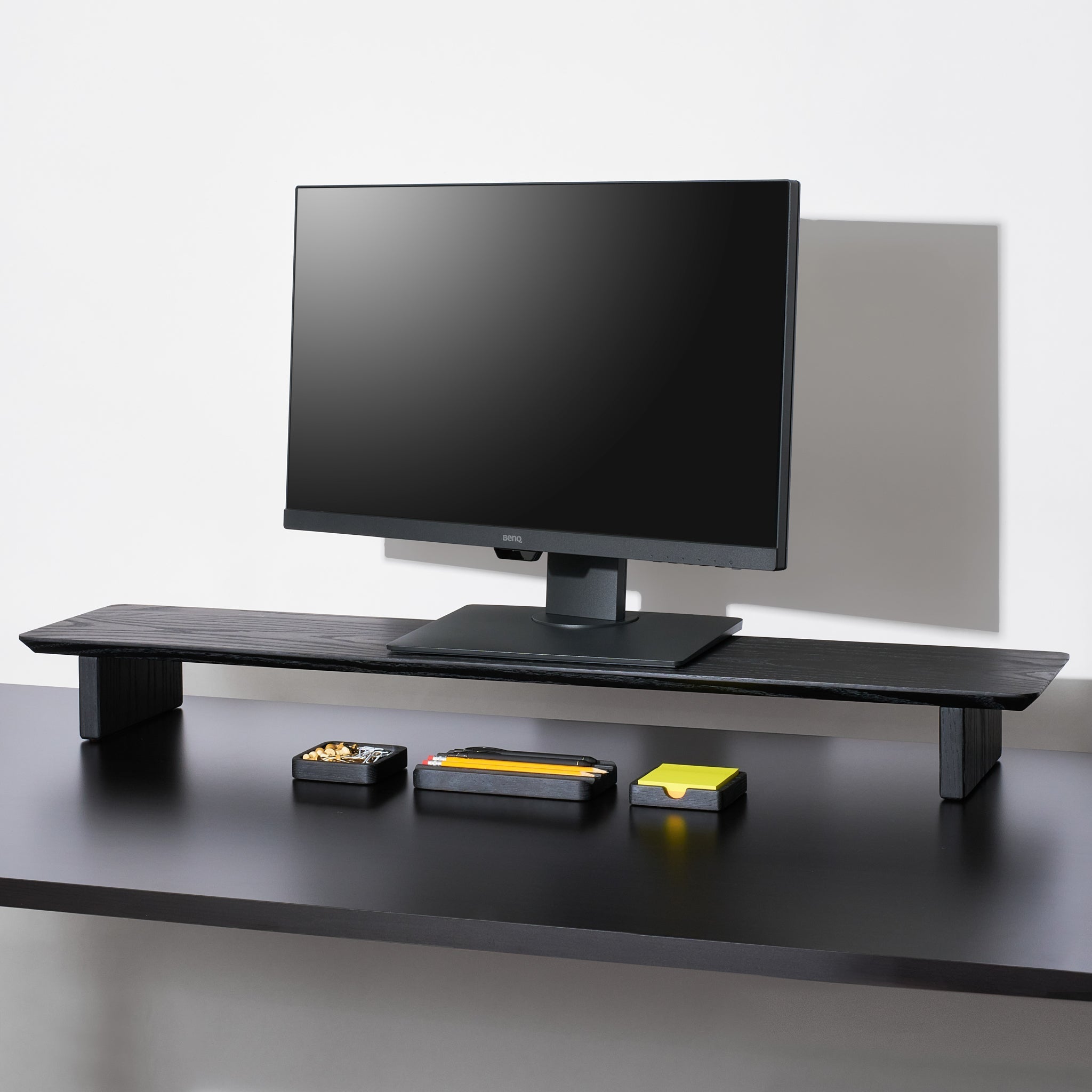 A large Black desk shelf with the essentials desk accessories for workspace organization