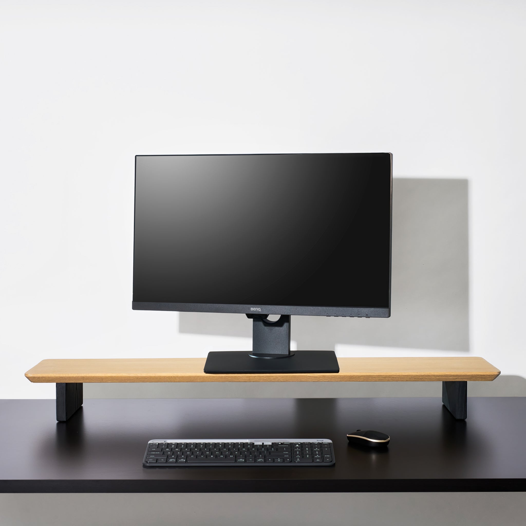  A Large White Oak desk shelf large enough for dual monitor setups