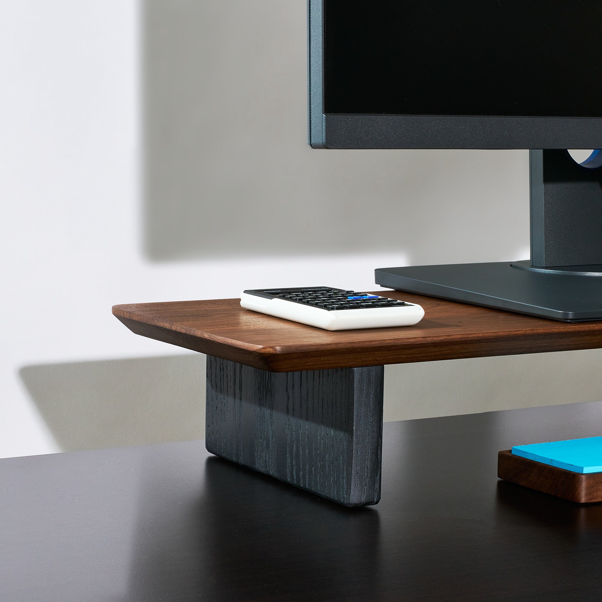 A medium Walnut desk shelf with black oak legs