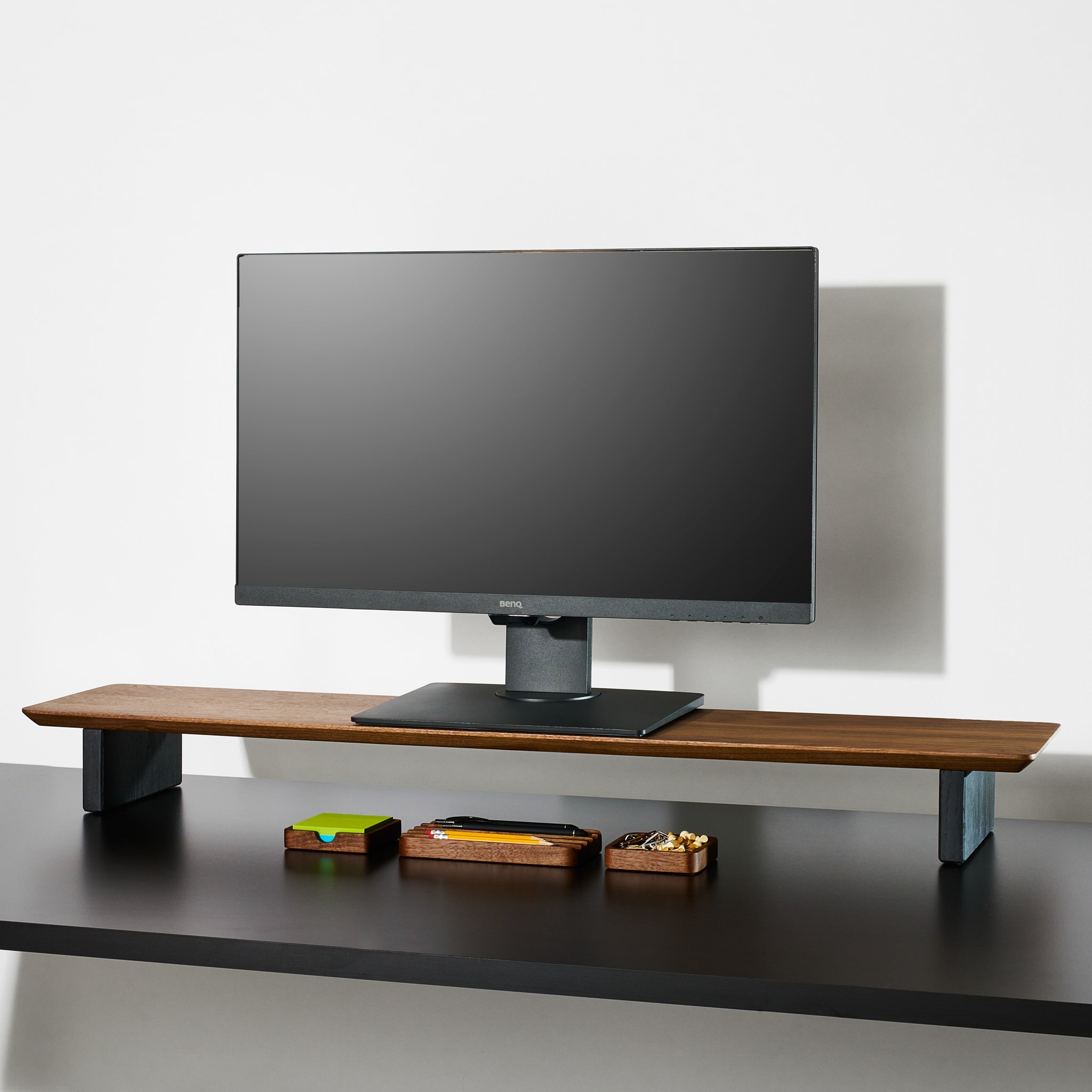 A large Walnut desk shelf with the essentials desk accessories