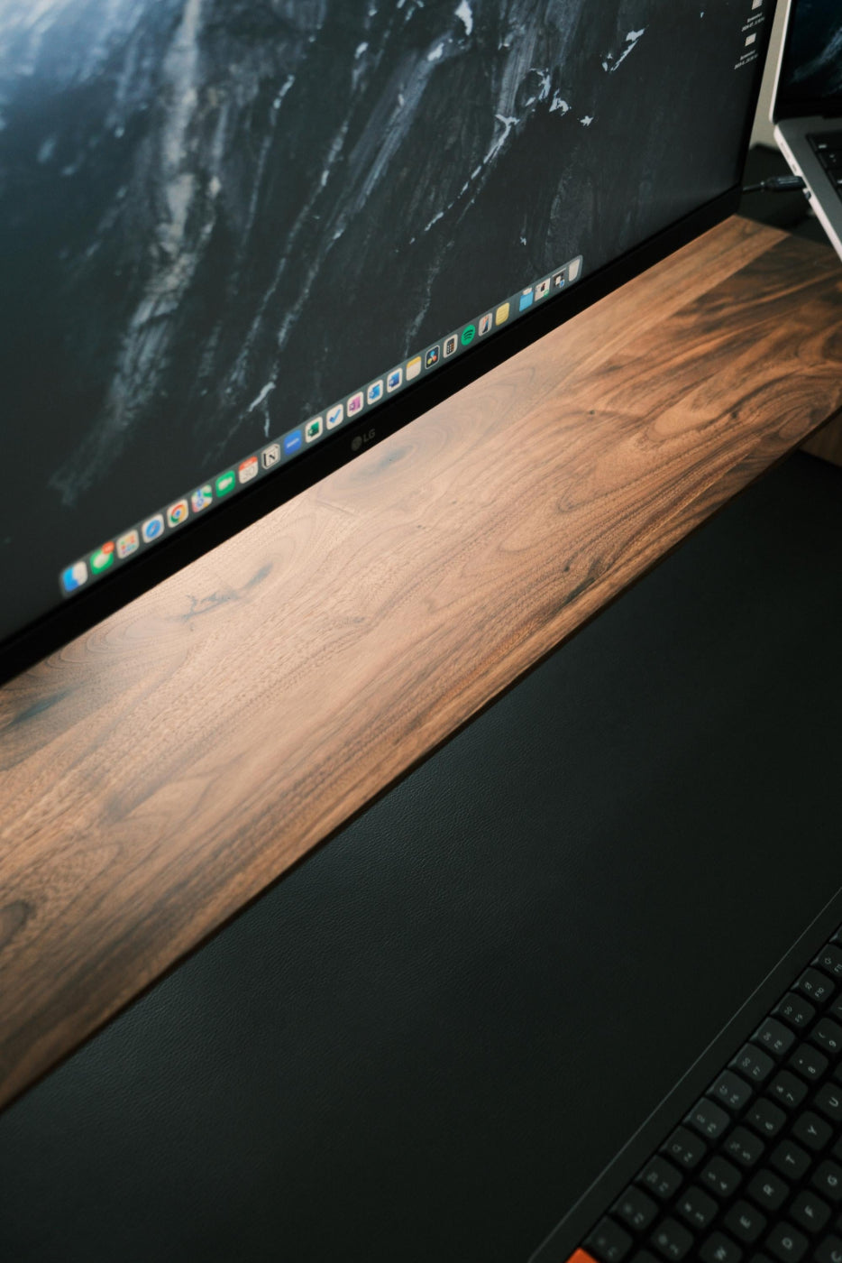 Close-up of a computer setup with a monitor, keyboard, and mouse on a desk.