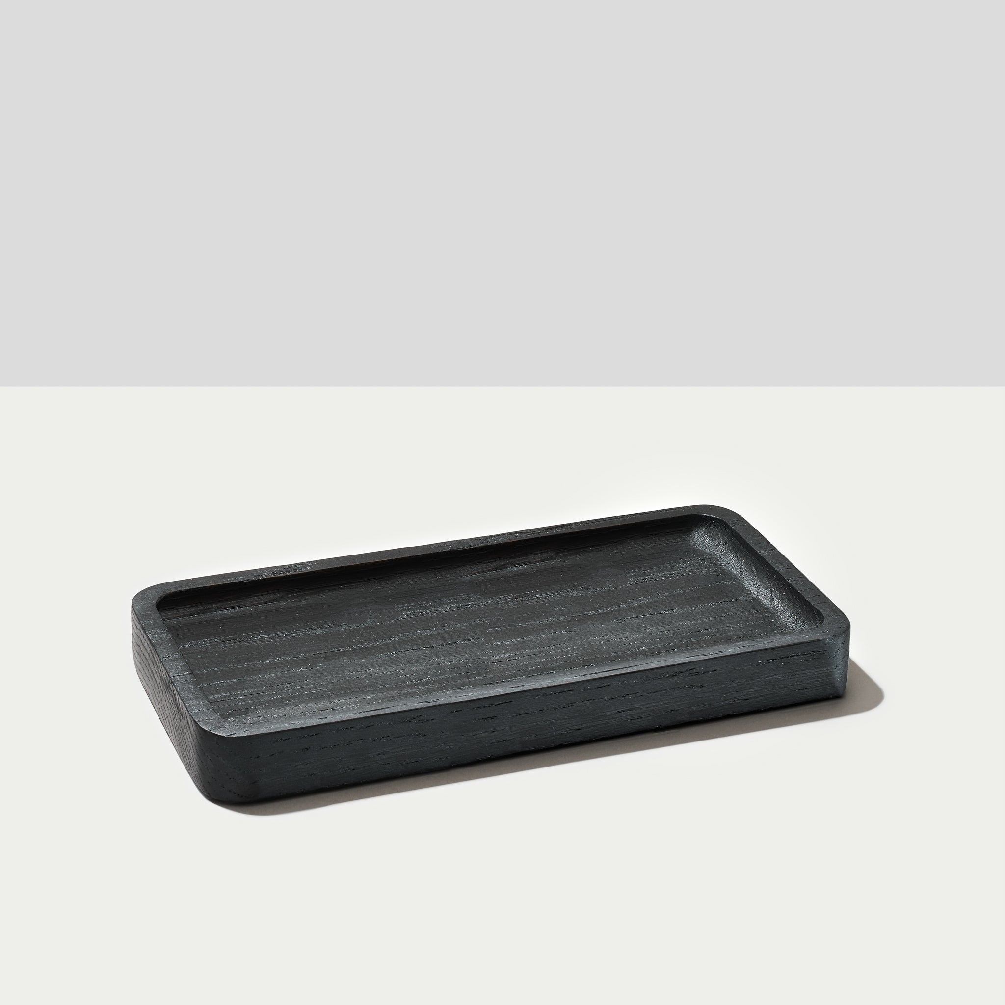 A Large catchall tray in black oak wood from Modhaus