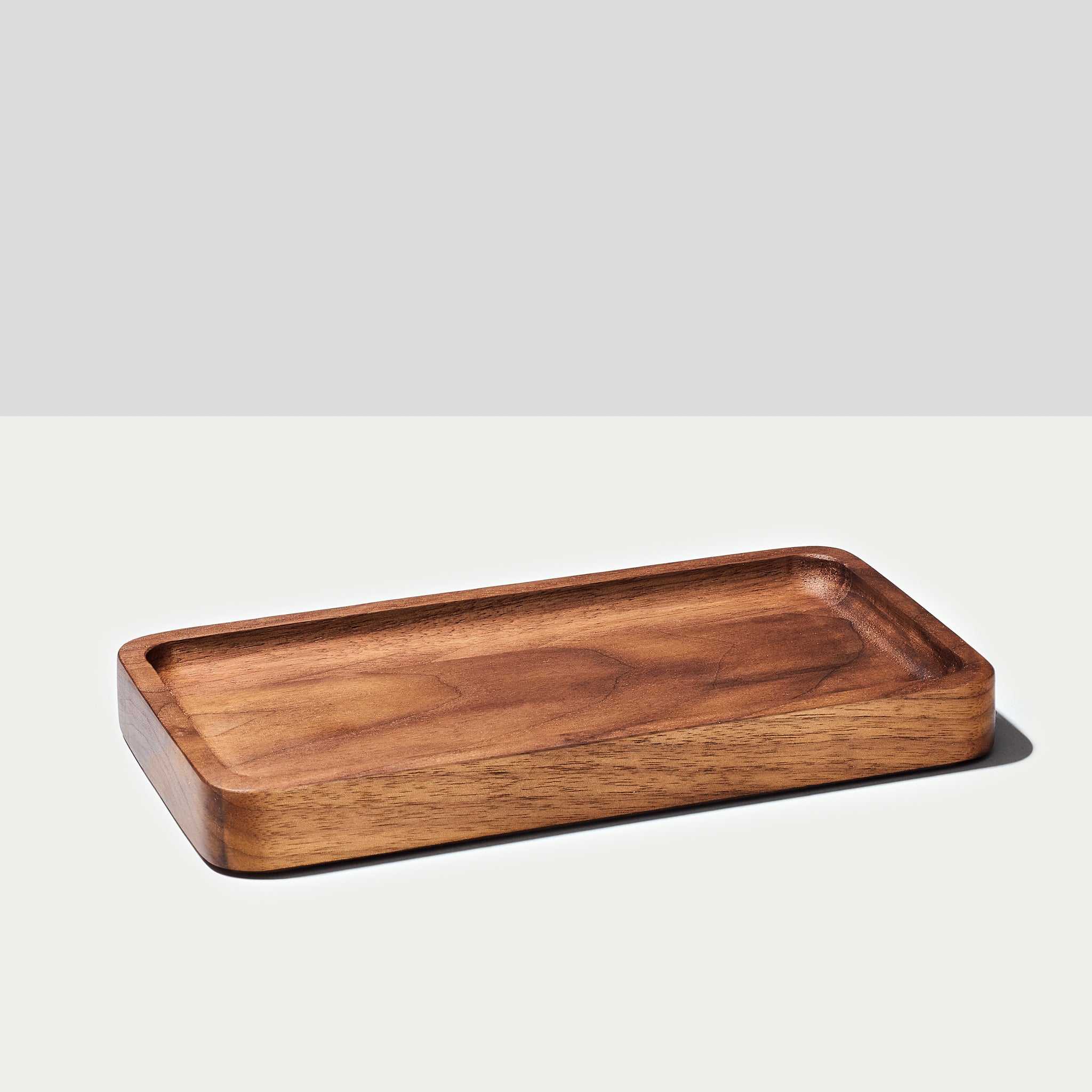 A Large catchall tray in walnut wood from Modhaus