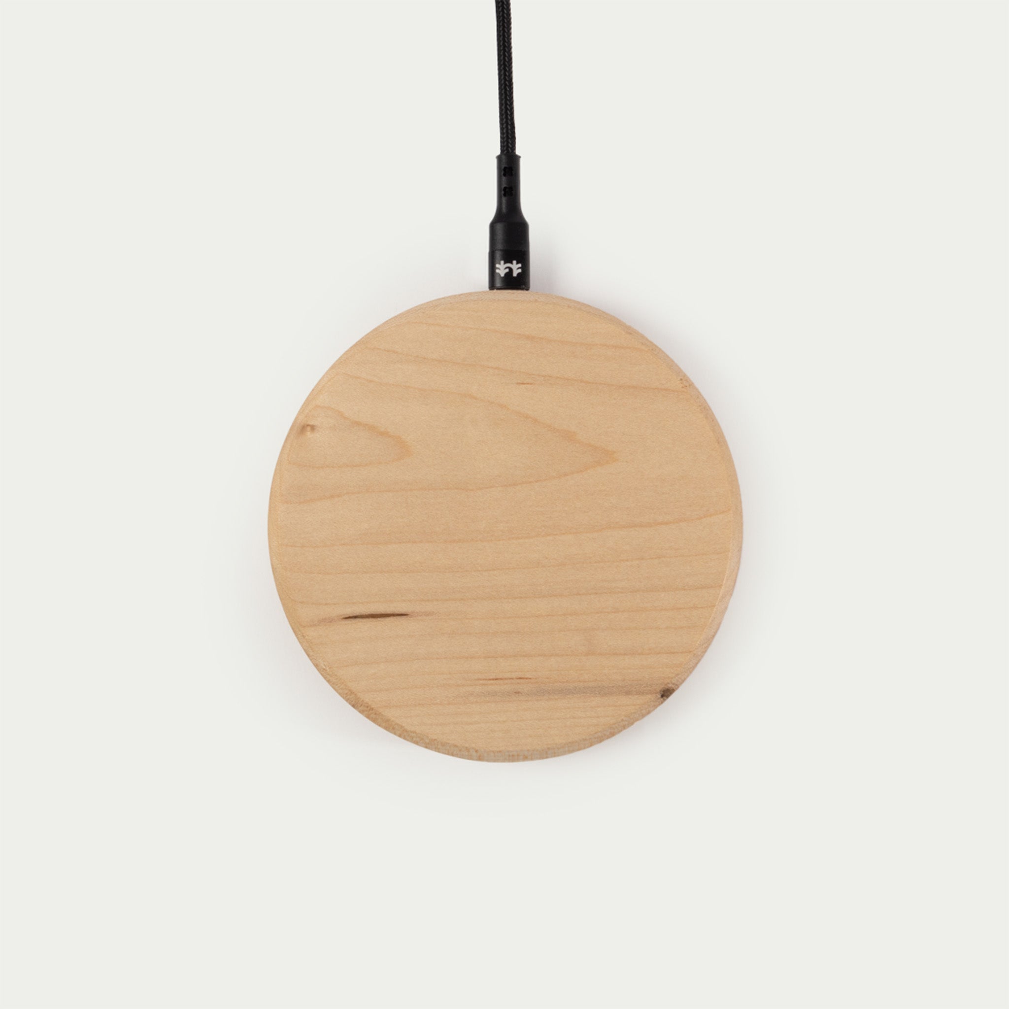 Modhaus' wireless charging pad in Maple wood. Qi Charging technology made with natural materials makes for an aesthetic minimal charger.