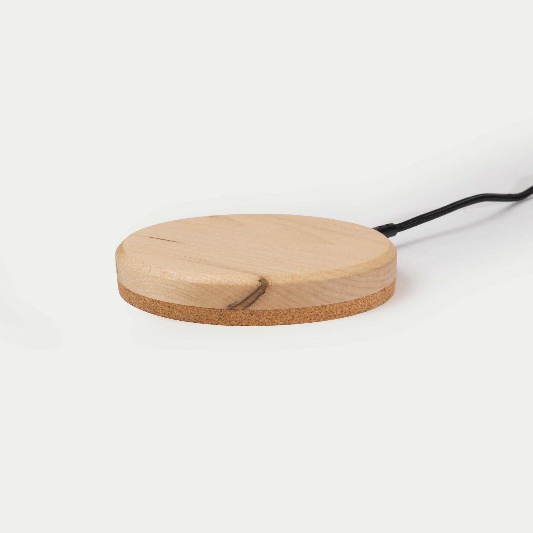 Modhaus' wireless charging pad in Maple wood. Qi Charging technology made with natural materials makes for an aesthetic minimal charger.