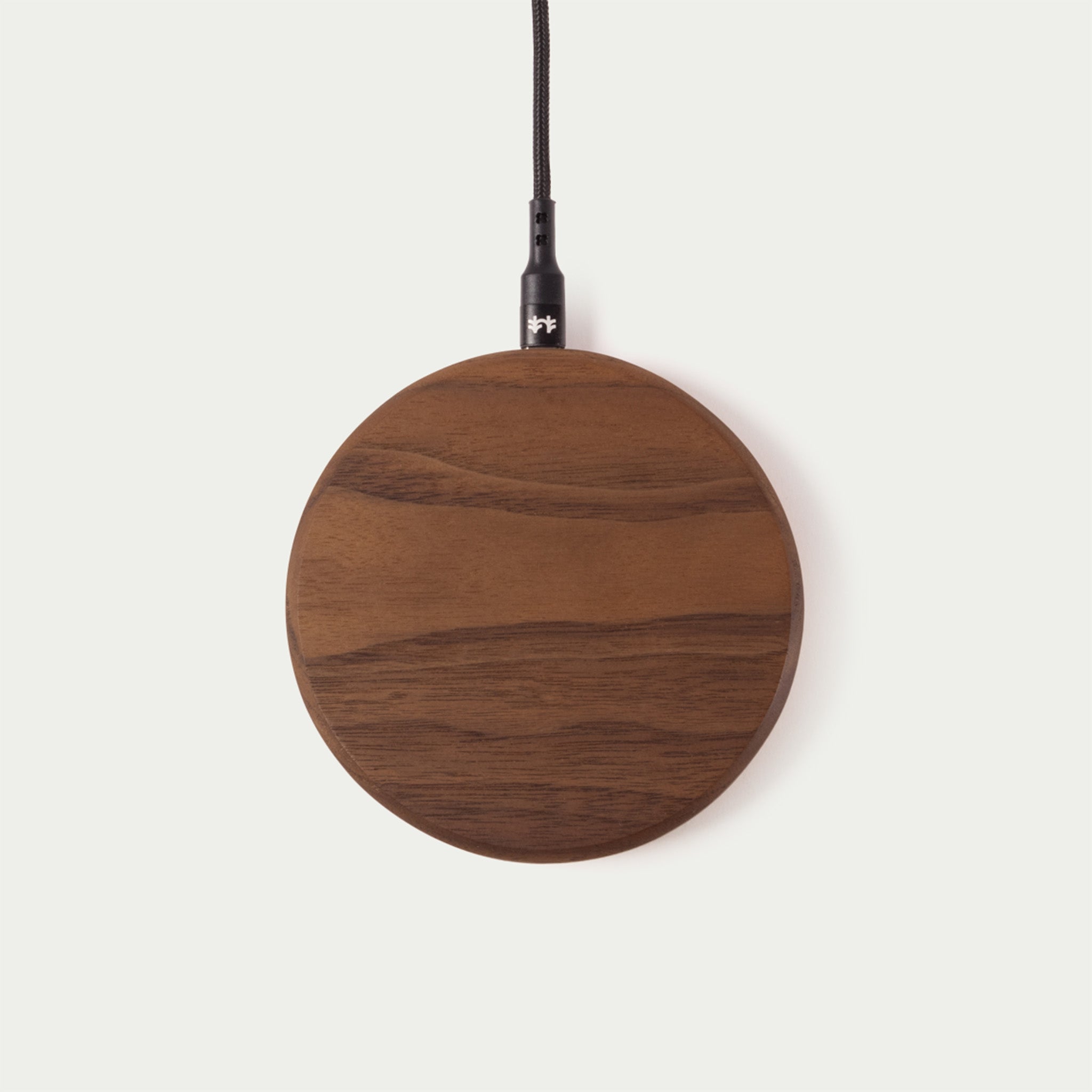 Modhaus' wireless charging pad in Walnut wood. Qi Charging technology made with natural materials makes for an aesthetic minimal charger.