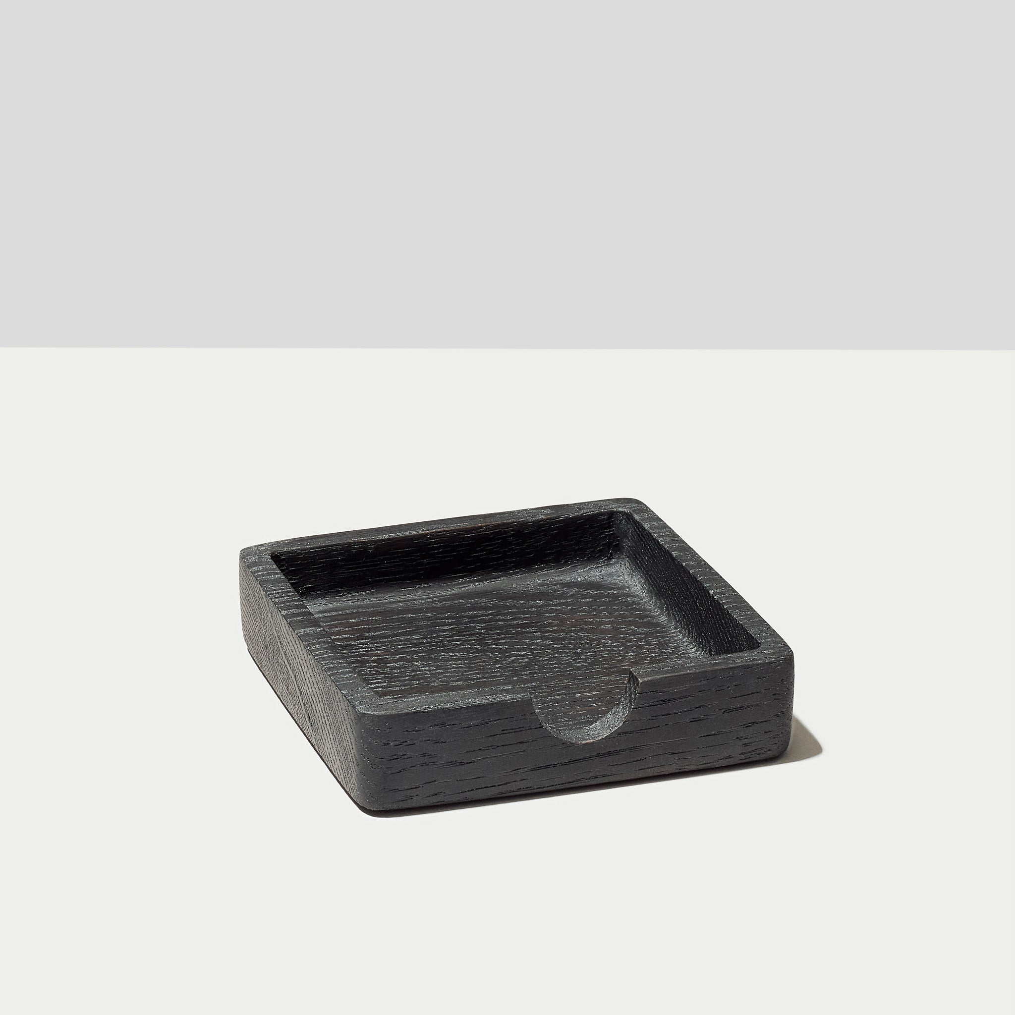 The Modhaus sticky note tray in black oak. Part of the larger Essentials set