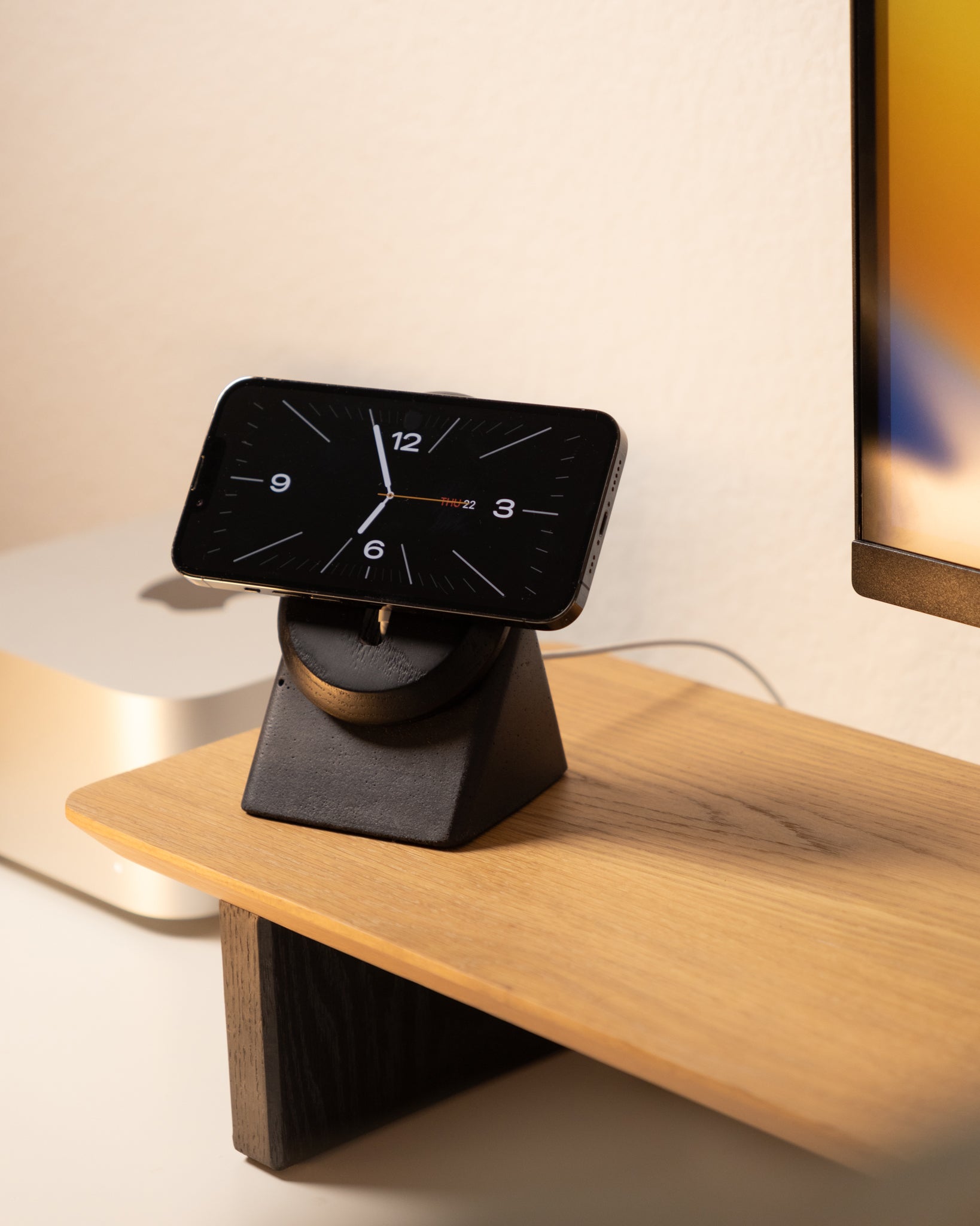 Modhaus's contemporary MagSafe charging stand for iPhones made from cement and solid wood.