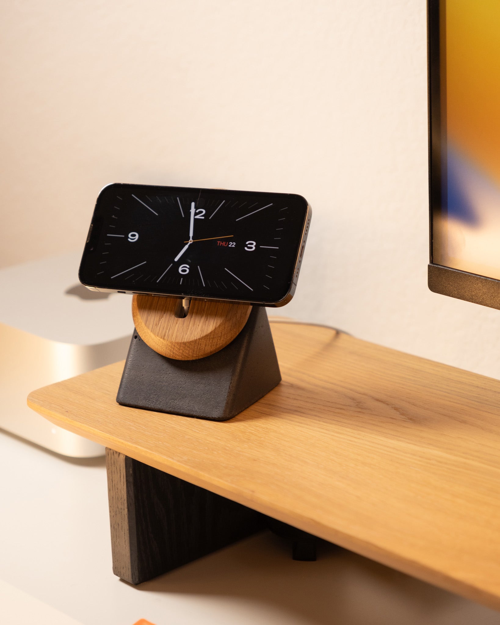 Modhaus's contemporary MagSafe charging stand for iPhones made from cement and solid wood.